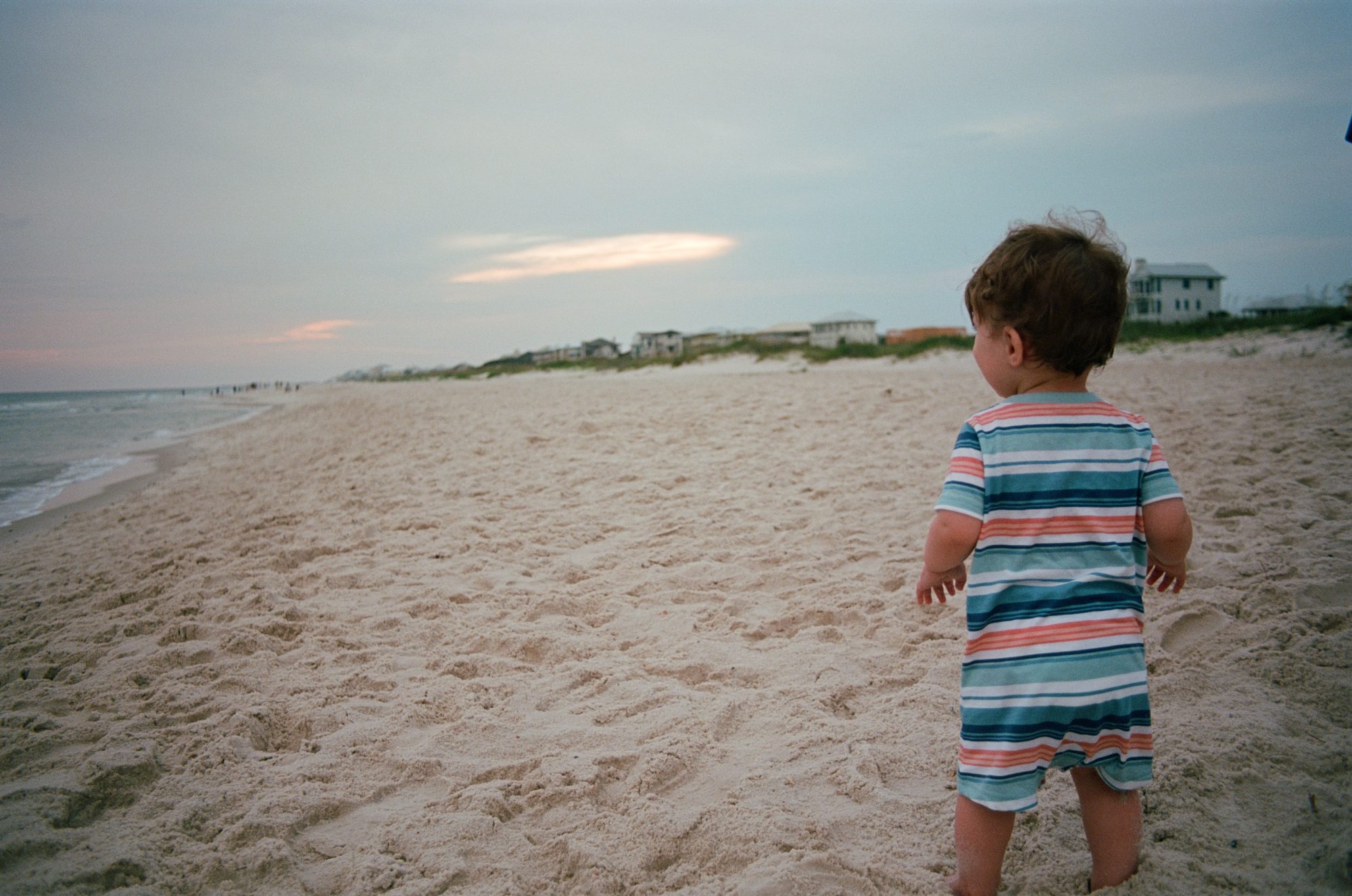 First Time at the Beach — Gulf Shores, Alabama. Color photograph by Jeff Pearson.