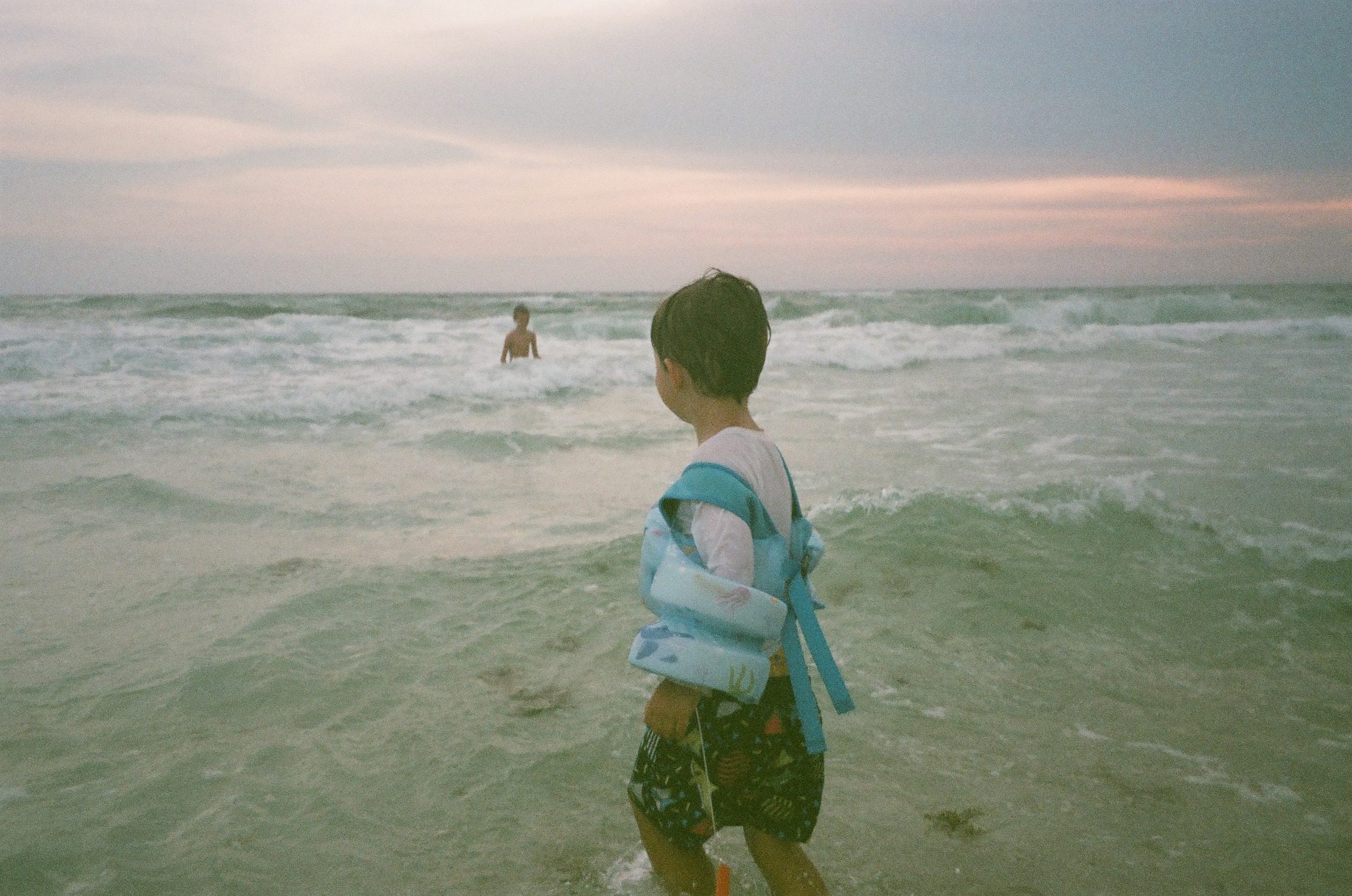 Swimming at Sunset — Panama City Beach, Florida. Color photograph by Jeff Pearson.